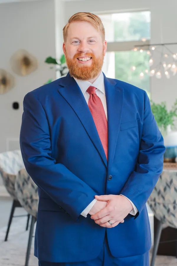 Business portrait in a blue suit indoors